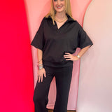 Black scuba matching set with collared short sleeve top and center seam pants.