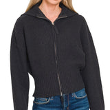Black ribbed collared zip-up sweater with two-way zipper and soft textured knit.