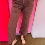 Brown wide leg cropped jeans with front pintuck detail and relaxed fit.