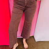 Brown wide leg cropped jeans with front pintuck detail and relaxed fit.