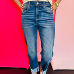 Cuffed skinny denim jeans with stretch fabric, high rise, and slim leg opening for a flattering fit.