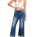 Mid-rise straight denim pants with raw hem in soft stretch fabric.