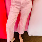 Pink wide leg cropped jeans with front pintuck detail and relaxed fit.