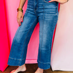 Wide leg cropped denim jeans with front pintuck detail and relaxed fit.