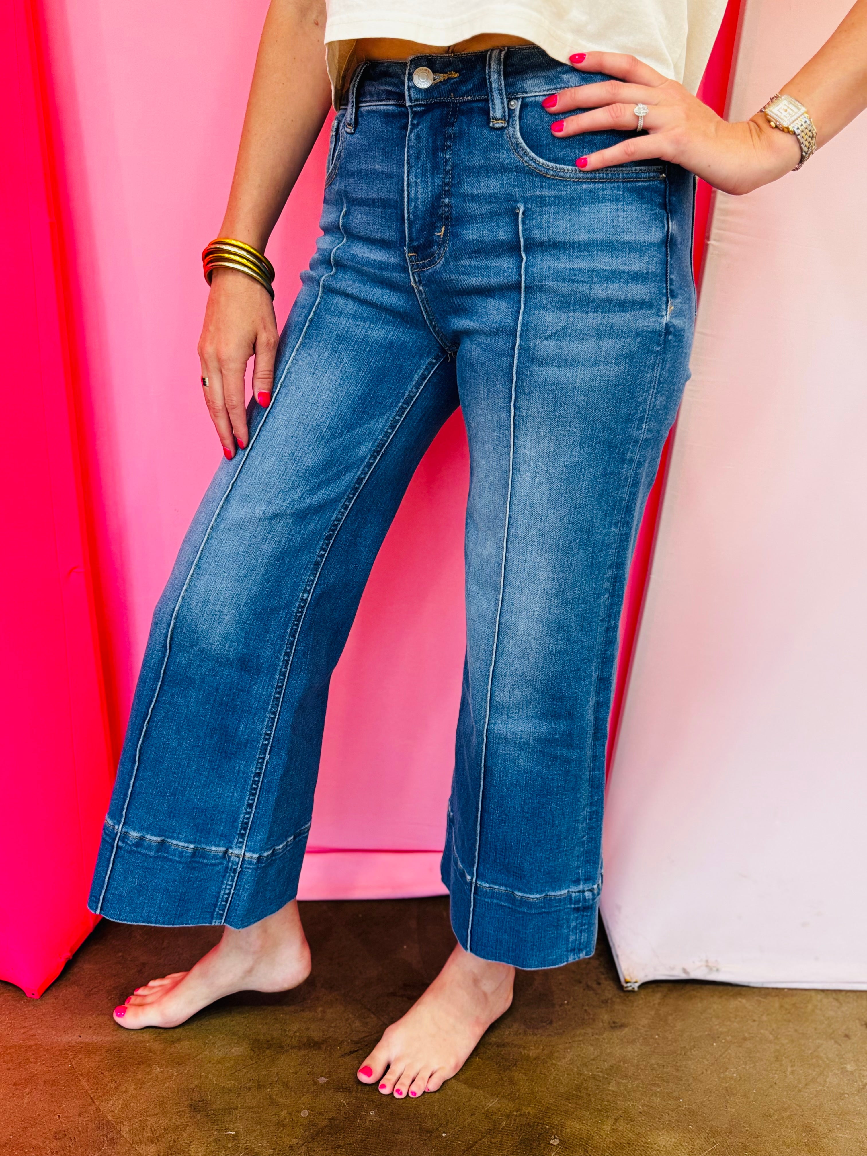 Wide leg cropped denim jeans with front pintuck detail and relaxed fit.