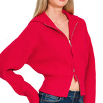 Ruby red ribbed collared zip-up sweater with two-way zipper and soft textured knit.