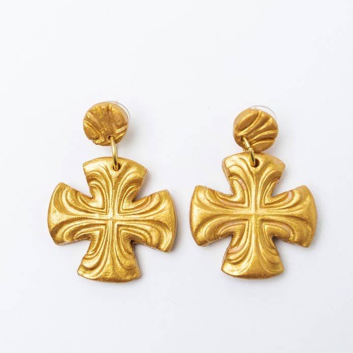 A pair of gold-colored double dangle earrings with a cross design.