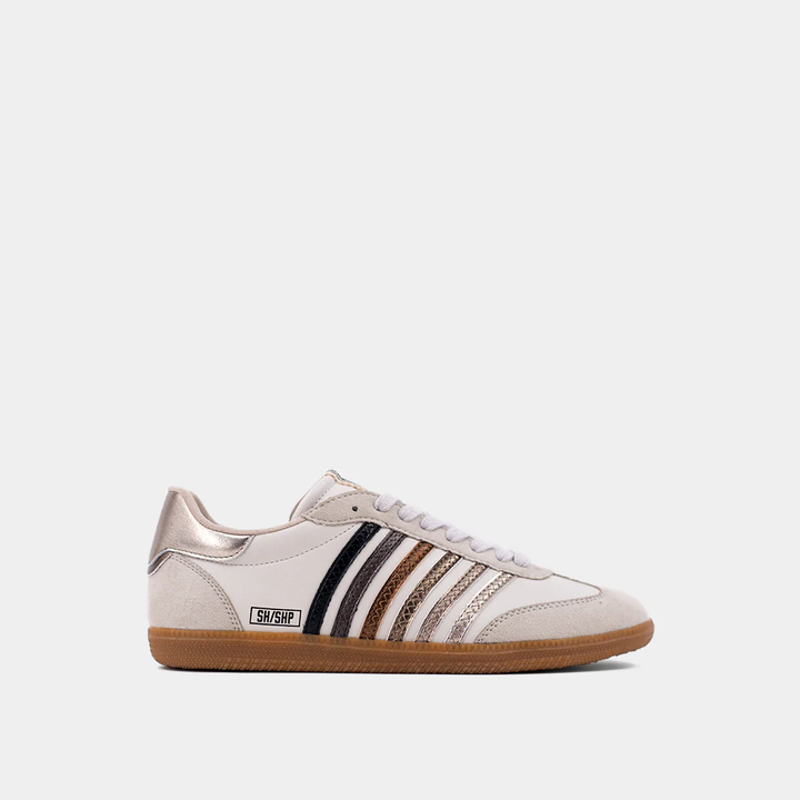 Off white sneakers with metallic stripes in black, charcoal, bronze, and silver with rounded toe and gold heel tap.