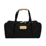 Jon Hart Carry-All duffel in coated canvas with natural leather trim, shoulder strap, and trolley sleeve.