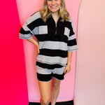 Black striped half-zip top and shorts set with wide sleeves and elastic waistband