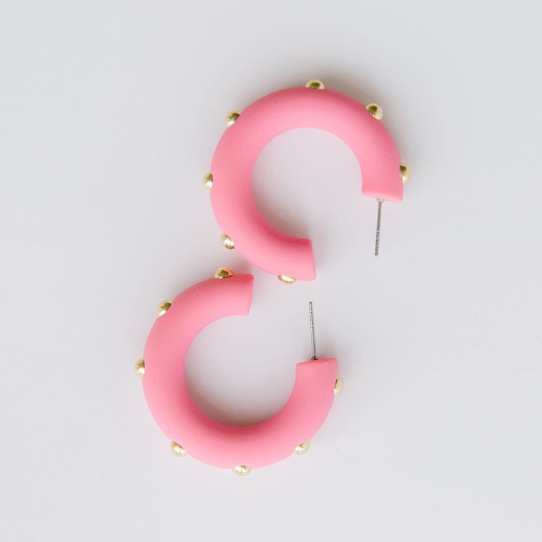 Candace bubble gum hoop earrings with gold studs. 