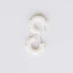 Candace white hoop earrings with gold studs. 