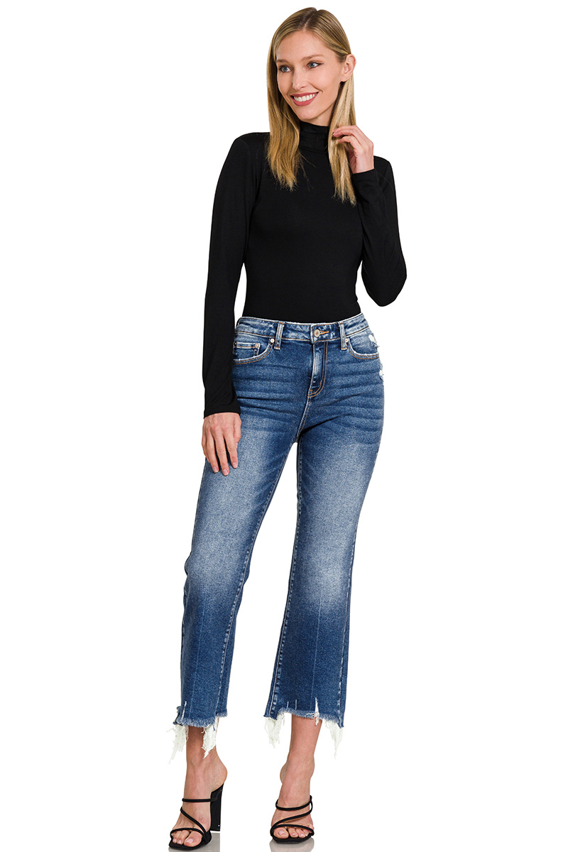 Blue denim kick crop flare jeans. The jeans have a high-waisted fit, are snug through the thigh, and flare out slightly above the ankle, showing the person's footwear.