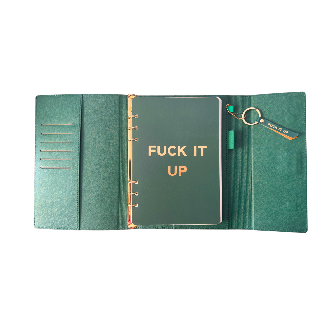 Inside view of green clutch folio journal with calender and matching pen. 'FUCK IT UP' gold foil text.