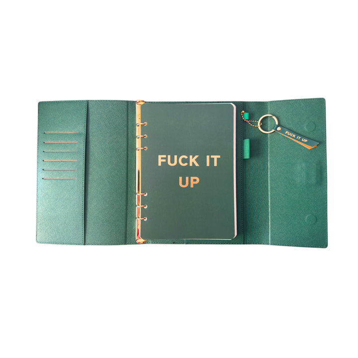 Inside view of green clutch folio journal with calender and matching pen. 'FUCK IT UP' gold foil text.