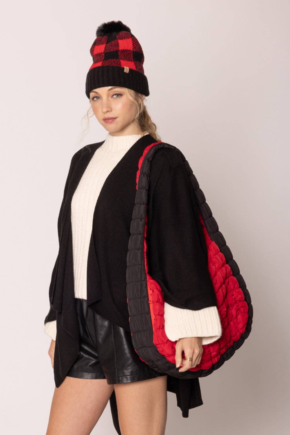 red bag with black sides quilted puffer bag