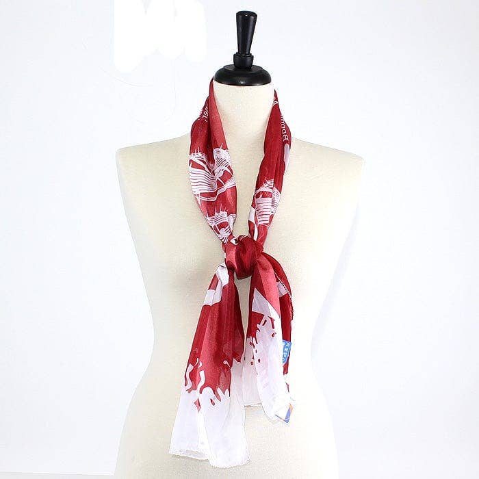 Crimson and cream Oklahoma Sooners knit scarf with printed school song lyrics and fringed edges, showcasing school pride in a stylish and cozy way.