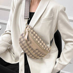 View of model wearing the beige checkered crossbody bag.