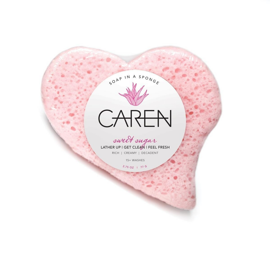 A pink, heart-shaped, soap-infused sponge. 
