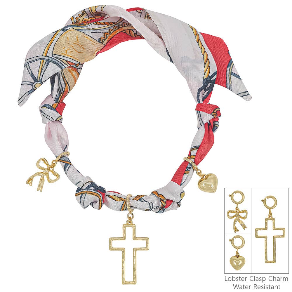 Red and white knotted scarf necklace with removable heart, cross, and bow charms.