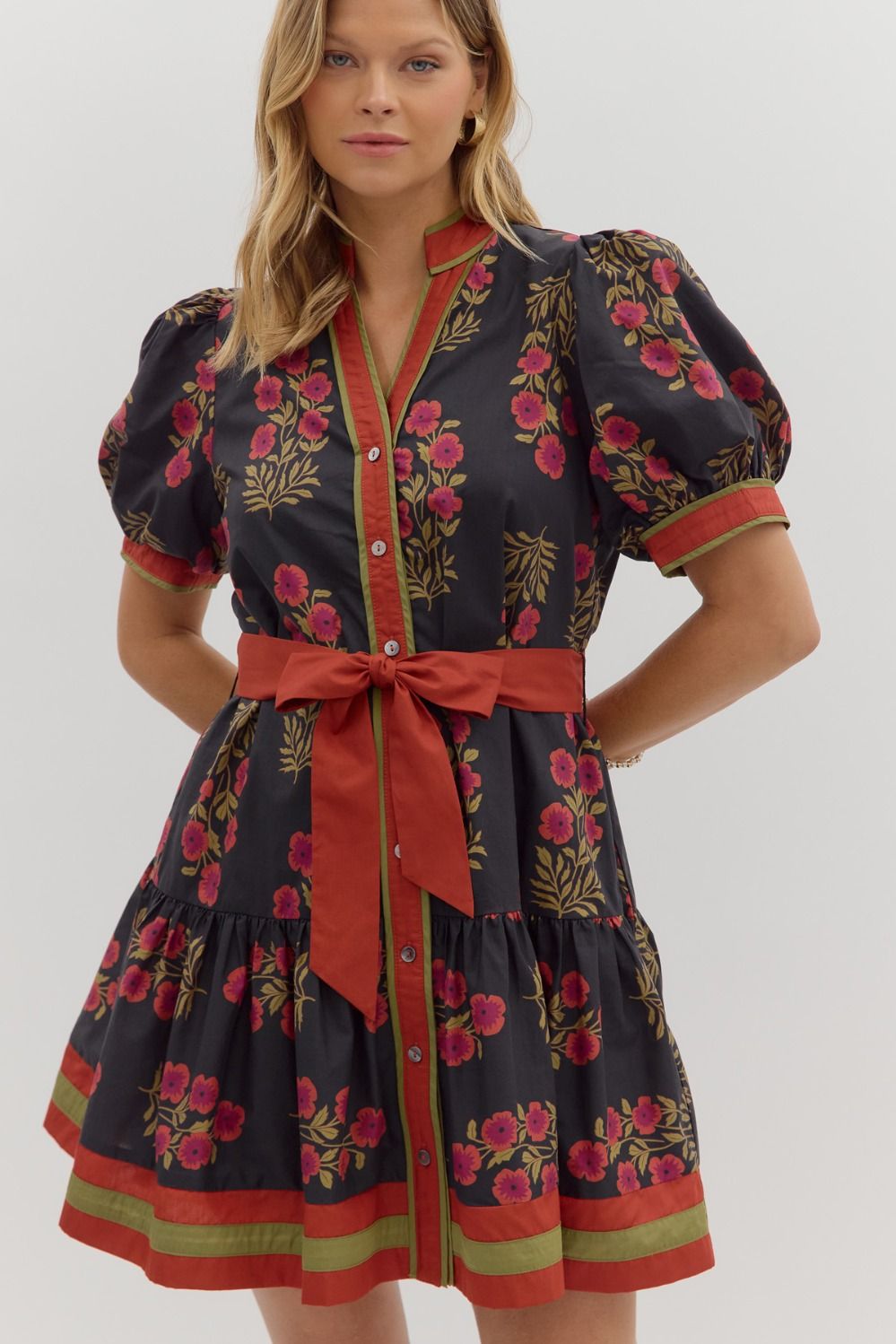 Black & Red Floral Dress with short puff sleeves, ruffle hem, removable belt, and side pockets.