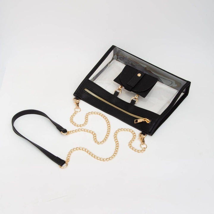 Clear crossbody bag with black trim, gold hardware, and a detachable sunglasses holder—fun, functional, and stadium-approved.