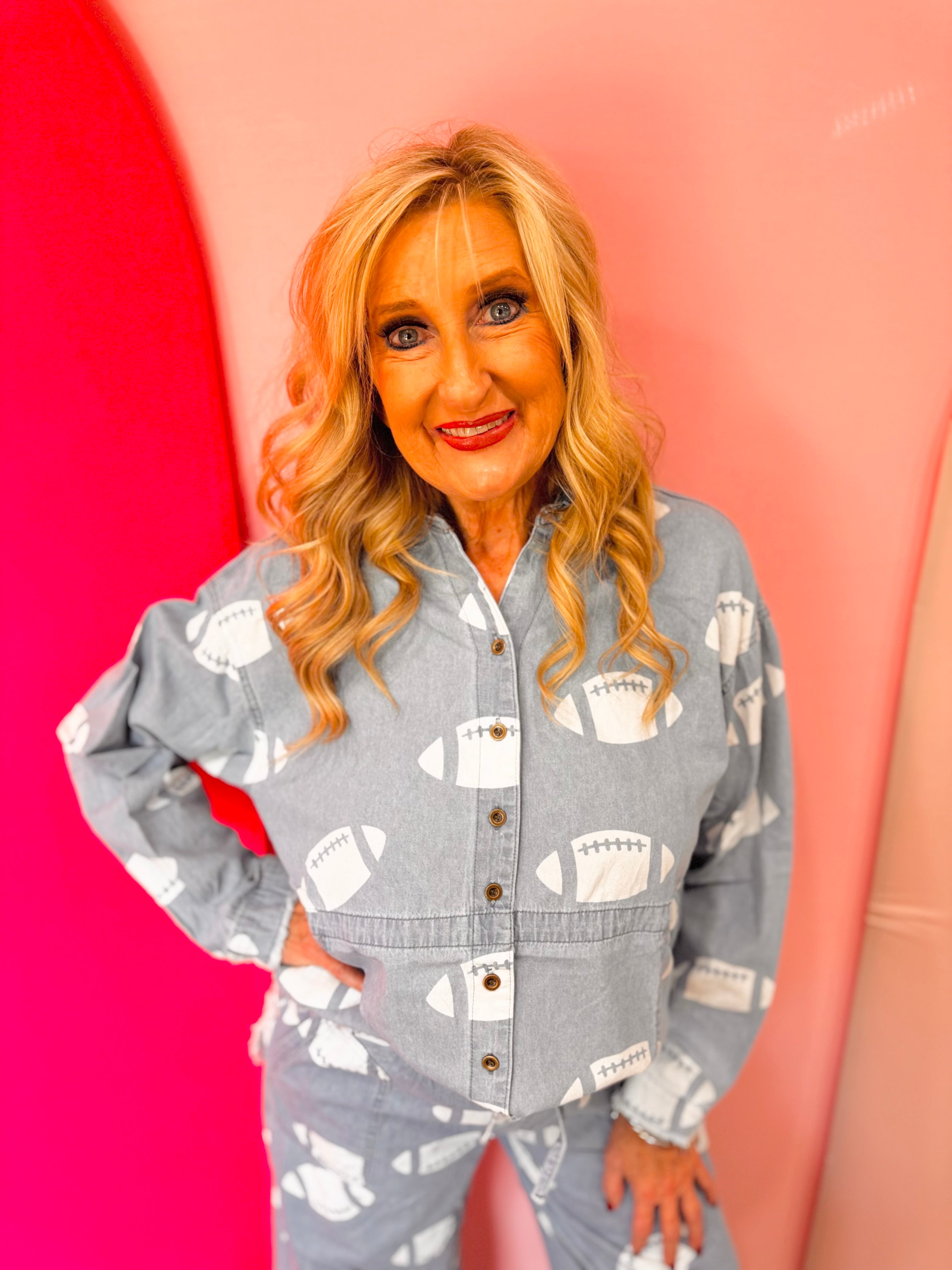Chambray football print button-down top with frayed hem.