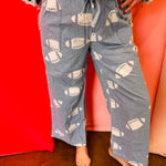 Chambray wide leg pants with white football print and drawstring waist.
