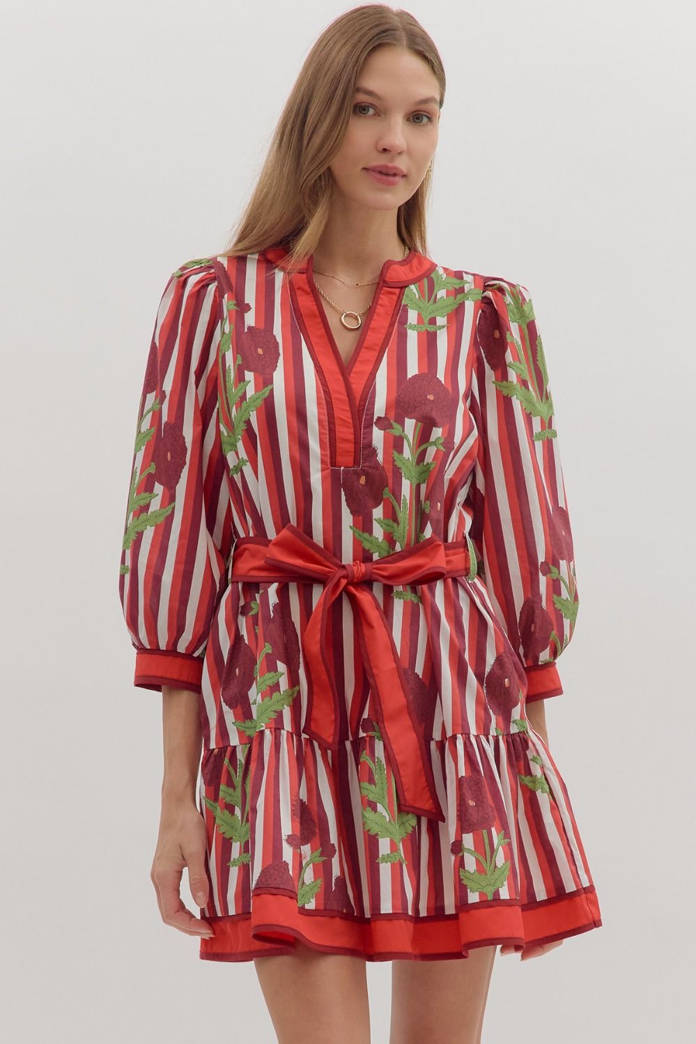 Garnet Stripe Floral Dress with 3/4 puff sleeves, V-neck, ruffle hem, and adjustable belt.