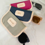 Jon Hart Glasses Case with coated canvas, leather trim, and gold zipper for durable, personalized protection.