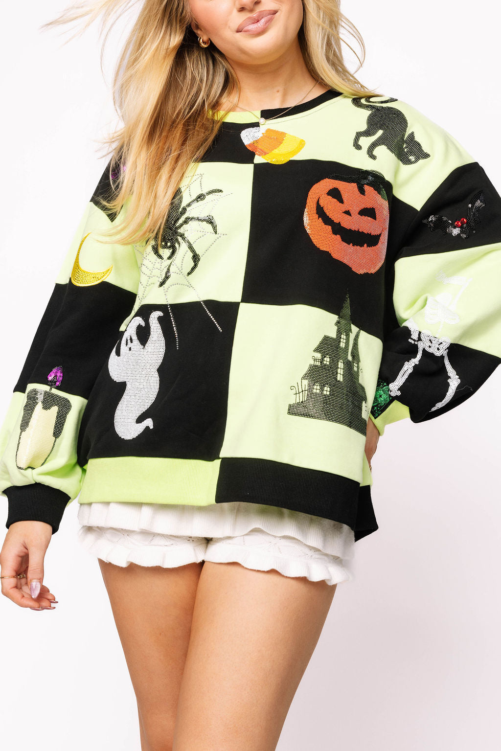 Green and black checkered Halloween sweatshirt with rhinestone and sequin Halloween  motif.