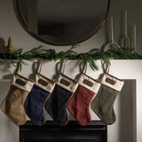 Jon Hart holiday stocking in coated canvas with leather trim and customizable leather patch for personalization.