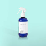 Volcano Linen Spray bottle featuring citrus notes of tangerine and grapefruit, designed to refresh and deodorize fabrics in your home, car, or on the go.