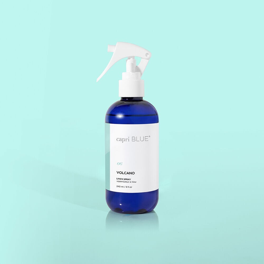 Volcano Linen Spray bottle featuring citrus notes of tangerine and grapefruit, designed to refresh and deodorize fabrics in your home, car, or on the go.