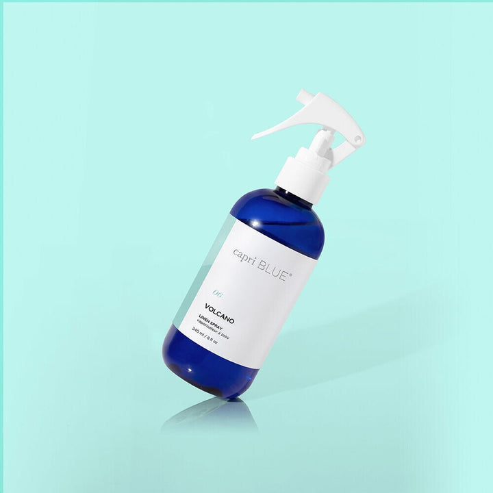 Volcano Linen Spray bottle featuring citrus notes of tangerine and grapefruit, designed to refresh and deodorize fabrics in your home, car, or on the go.