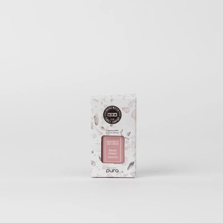 A Pura Sweet Grace fragrance refill vial in a white box with floral patterns and the Pura logo.