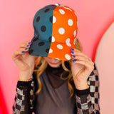 Orange and gray polka dot half design snapback hat with curved brim.