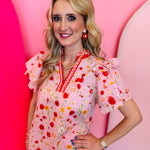 Blush pink floral blouse with poppy print, gingham trim neckline, ruffle collar, and flutter sleeves