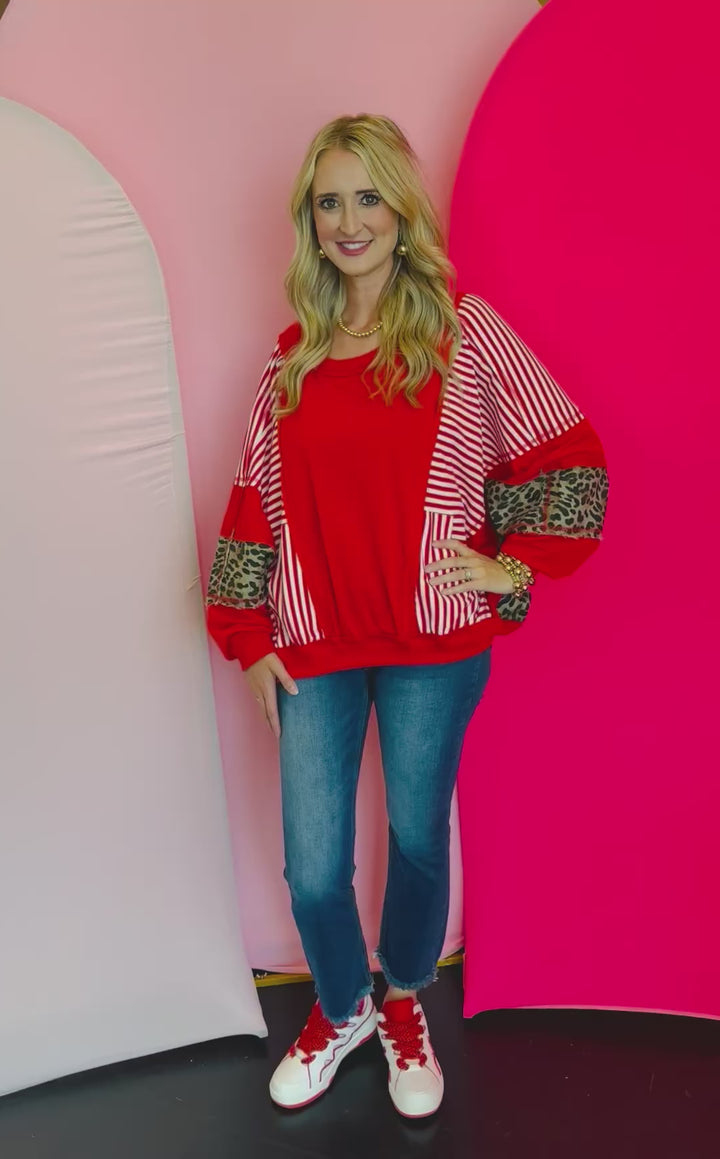 Video of Red, stripe, and leopard oversized Dolman style long sleeve sweatshirt.
