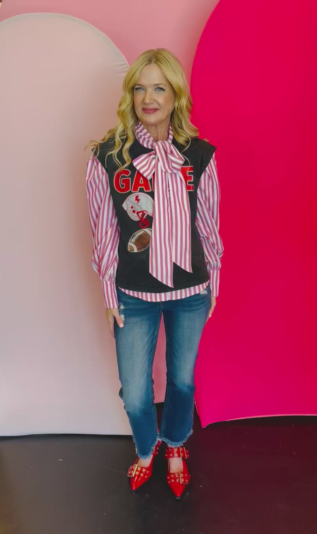 Video of Red and white stripe tie front blouse.