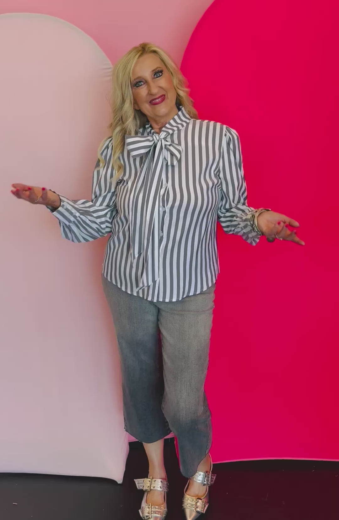 Video of Charcoal black striped front bow tie blouse.