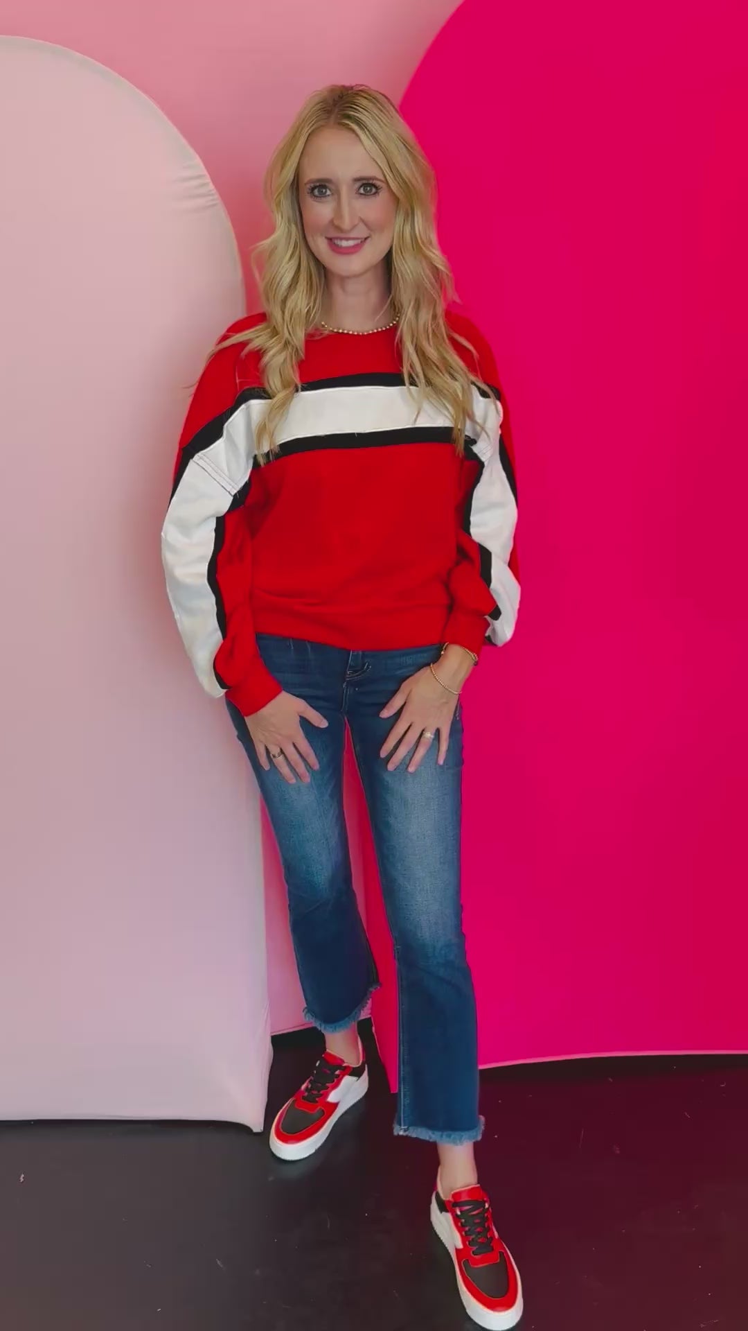 Video of Colorblock red top with white and black stripe.