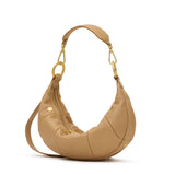 Hammitt Erica SML Toasty Sand croissant bag with gold rivets and straps.