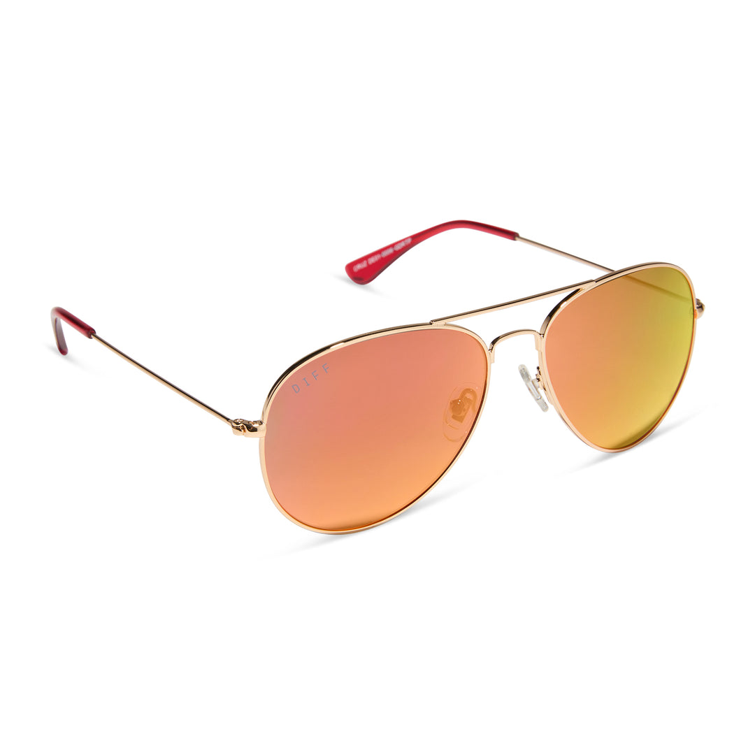 Aviator sunglasses with gold frame and red/orange-tinted lenses on a white background