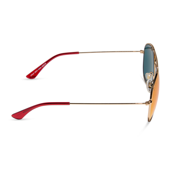 Side angle of DIFF Cruz sunglasses showing slim gold arms and reflective red lenses with nose pads.

