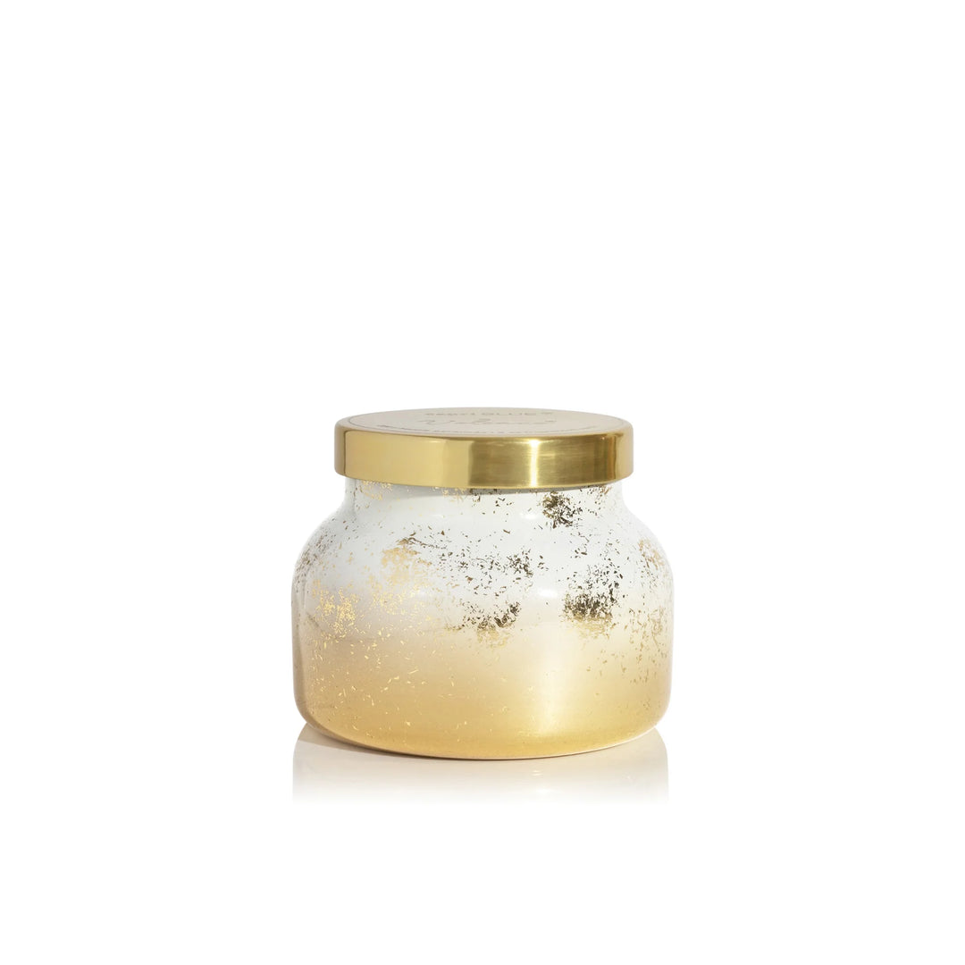 Capri Blue - 8oz Volcano Glimmer Petite Candle with a white and gold finish.