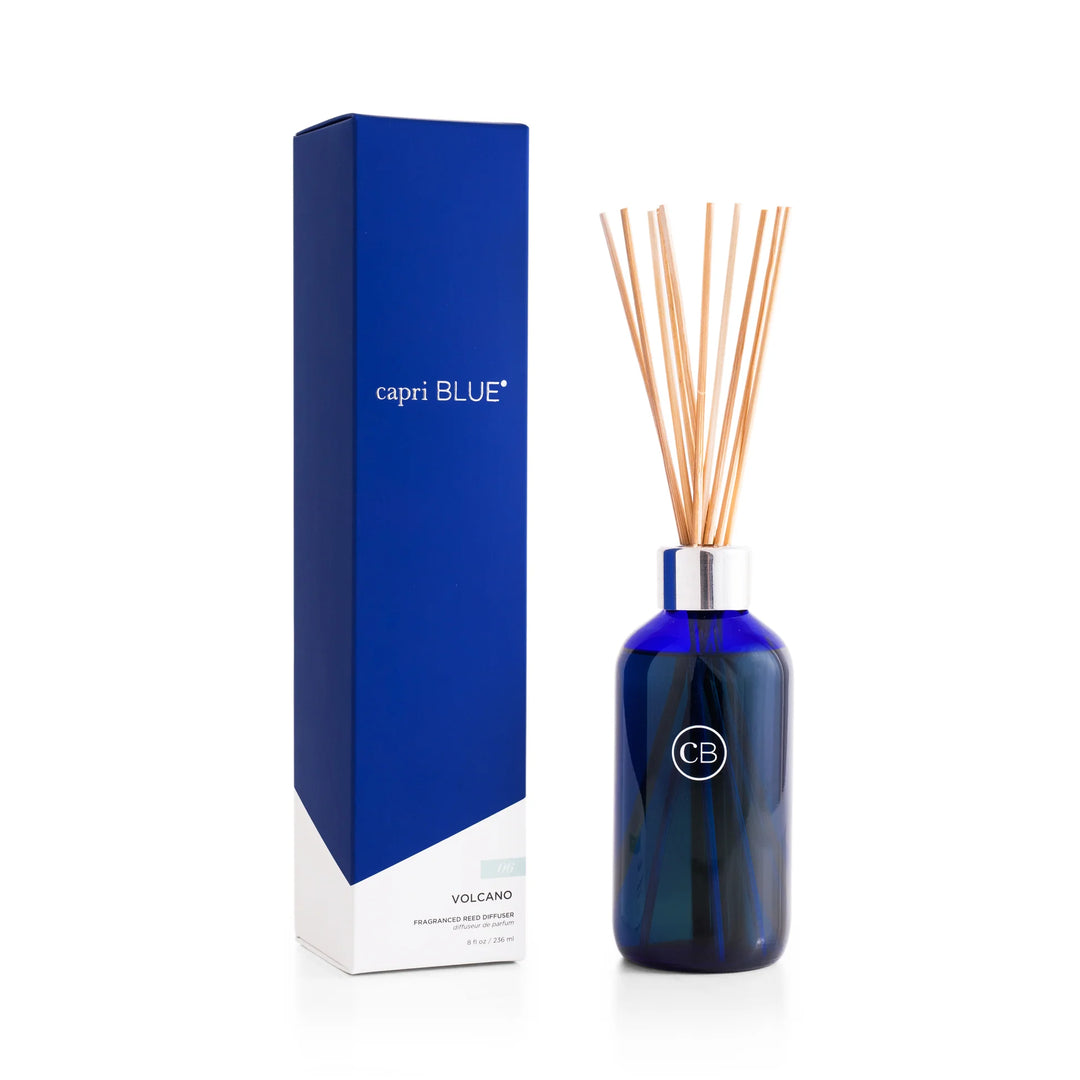Volcano Signature Reed Diffuser 8oz – flameless tropical citrus-scented home fragrance in a sleek blue glass bottle.
