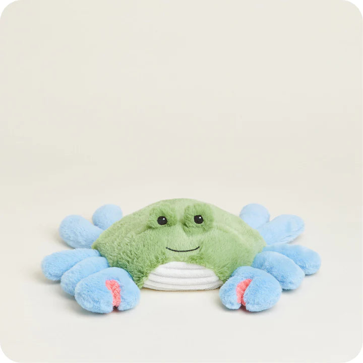 A soft, plush blue crab toy with friendly eyes, claws, and multiple legs, designed to be microwavable.