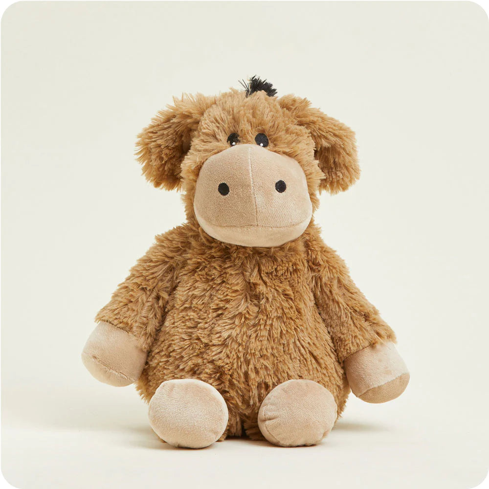 A soft, gray plush donkey toy with long ears and a friendly expression, designed to be microwavable.