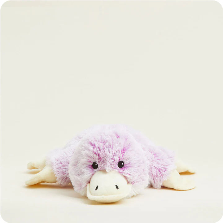 A soft, purple plush platypus toy with a wide bill and flat tail, designed to be microwavable.